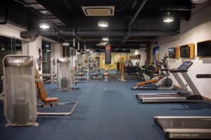 a gym with a lot of treadmills and machines at Anemon Grand Konya Otel in Konya