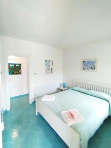 a bedroom with a bed with two towels on it at il poggio in Ischia +35 photos