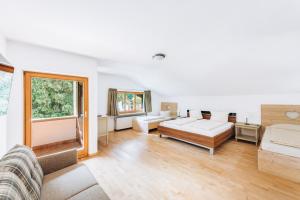 Postel nebo postele na pokoji v ubytování Hotel Garni Nuss
