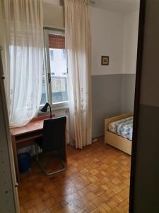 Postel nebo postele na pokoji v ubytování Camera in appartamento