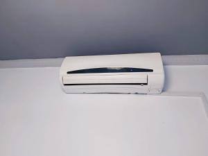 a white printer sitting on top of a shelf at HABITACION ROOM Larga Temporada MAS DE 60 DIAS MALAGA CENTRO in Málaga