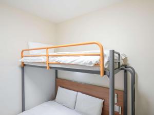 Postel nebo postele na pokoji v ubytování Comfort Inn Hitachinaka + 19 fotografií