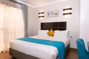 Postel nebo postele na pokoji v ubytování Eseriani The Hotel