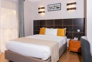 Postel nebo postele na pokoji v ubytování Eseriani The Hotel