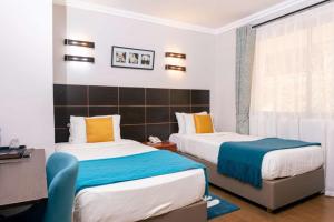 Postel nebo postele na pokoji v ubytování Eseriani The Hotel