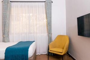 TV a/nebo společenská místnost v ubytování Eseriani The Hotel