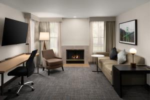 a living room with a couch and a fireplace at Residence Inn Portland Hillsboro in Hillsboro
