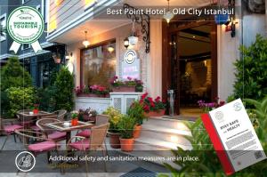 a restaurant with tables and chairs in front of a building at Best Point Hotel Sultanahmet,Istanbul in Istanbul
