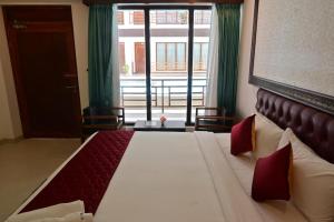 Postel nebo postele na pokoji v ubytování Hotel Havelock Gateway