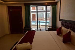 Postel nebo postele na pokoji v ubytování Hotel Havelock Gateway