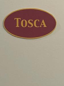 a sign that says tosca on a wall at Gemütliches Souterrain Refugium in Offenbach