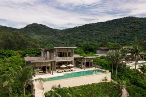 an aerial view of a villa with a swimming pool at Six Senses Con Dao - Turtle Island Paradise in Con Dao