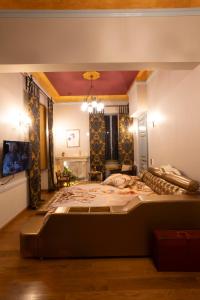 a bedroom with a large bed in a room at Medουσία Wellness Spa Heritage Suites in Chalkida