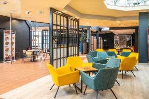 Χώρος καθιστικού στο Hotel Göttingen-West