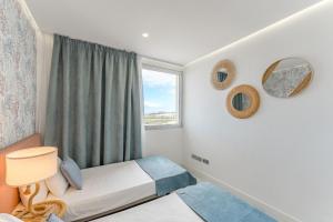 Postel nebo postele na pokoji v ubytování Ocean Garden Playa Paraiso