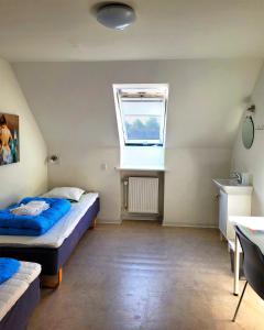 Postel nebo postele na pokoji v ubytování Aarhus Hostel og Hotel + 37 fotografií