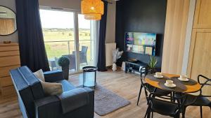 Telewizja i/lub zestaw kina domowego w obiekcie Apartament Buk