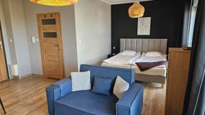 Łóżko lub łóżka w pokoju w obiekcie Apartament Buk