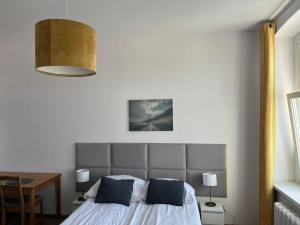 Łóżko lub łóżka w pokoju w obiekcie Narutowicza 5 Apartments