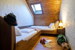 Postel nebo postele na pokoji v ubytování Slow Travel Resort Kirchleitn