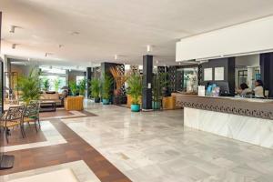 a lobby of a hotel with a bar at Apartamentos Parque del Sol in Adeje +166 photos