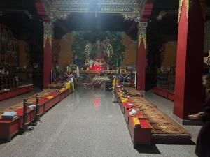 a large room with long tables in a temple at Home Stay Nunnery in Burhānilkantha