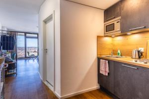 a kitchen with a sink and a counter at Fantastic Views Augsburg Center Luxury Congress in Augsburg