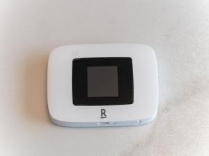a small white cell phone sitting on a table at Shinjuku, 3min walk from Nishi-Shinjuku 5-chome Sta, 3min Shinjuku Sta Switch, Wi-Fi ,Pocketwi-Fi in Tokyo