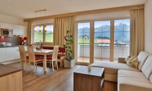a living room with a couch and a table at Haus Christina in Serfaus