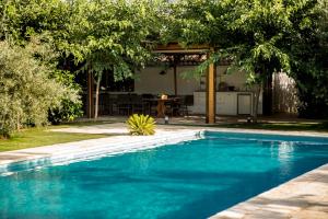 a swimming pool in the backyard of a house at Casa Valley Boutique in Melegis