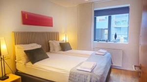 Postel nebo postele na pokoji v ubytování Reykjavik4You Apartments