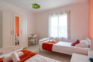 Posteľ alebo postele v izbe v ubytovaní L'escapade - Maison familiale avec jardin Vannes