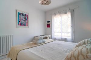 Posteľ alebo postele v izbe v ubytovaní L'escapade - Maison familiale avec jardin Vannes