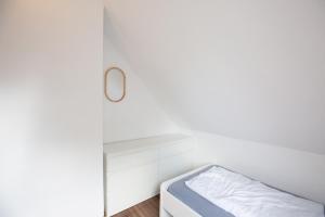 Кровать или кровати в номере Ferienwohnung am See