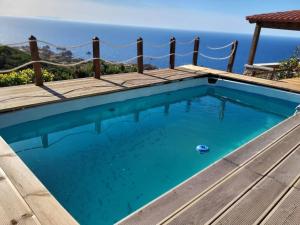 a swimming pool with a view of the ocean at Villa Mamia Pool Costa Paradiso in Costa Paradiso