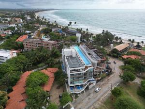 an aerial view of a city and the ocean at Flats no Nixxus Residence (Flats da Elena) in Porto De Galinhas