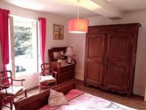 a living room with a couch and a window at l'èrmitage in Floing