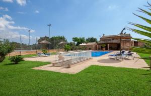 a resort with a swimming pool and a pavilion at Son Dalabau in Son Veri