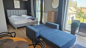 Łóżko lub łóżka w pokoju w obiekcie Apartament Buk