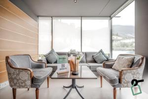 Istumisnurk majutusasutuses HOTIDAY Room Collection - Torbole