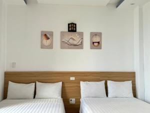 Postel nebo postele na pokoji v ubytování Thanh Hiền HB Hotel