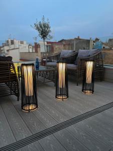a row of lights on top of a patio at Mamma Mia Hotel Boutique - Only Adults in Tossa de Mar