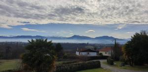a view of a valley with mountains in the distance at Pyrenees Vue Gite - Vues Fantastique, Parking Gratuit Sur Place & Piscine in Saint-Gaudens