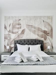 a bedroom with a bed with two books on it at New Comfortable Apartment in Rome