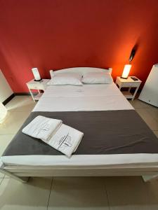Tempat tidur dalam kamar di Hotel Mirador del Dayman