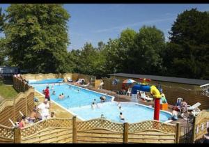 a group of people in a swimming pool at 35 Redwood - Beauport Park, Hastings in Hastings