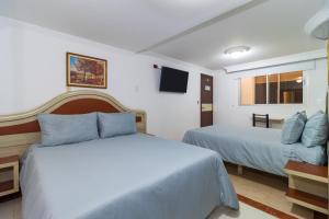 Postelja oz. postelje v sobi nastanitve Hotel Zulita
