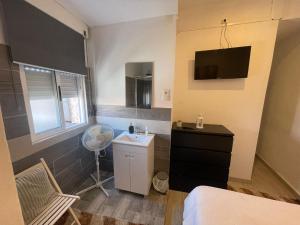 a small bathroom with a sink and a room at Guesthouse Franco in Porto +46 photos
