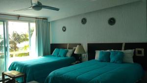 Postel nebo postele na pokoji v ubytování Apartment Ocean Front Cancun