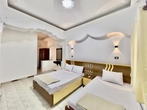 Postel nebo postele na pokoji v ubytování Home Hotel Dahab